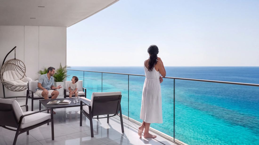 Official Eagle Hills render of a high-floor apartment balcony overlooking the ocean, with a family seated outside